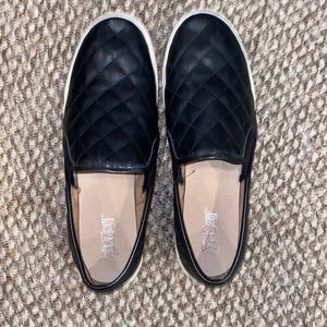 Black Argyle patterned slip ons